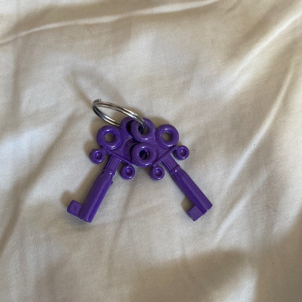 Purple key keychain. Don’t want anymore. Key ring is included!! 💜